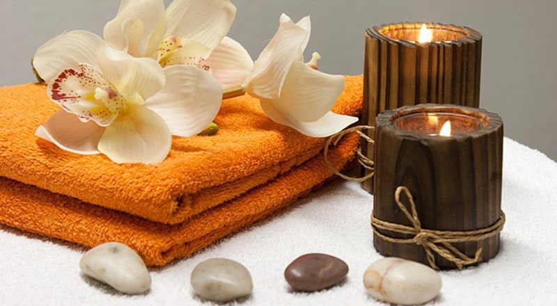 spa towels, candles and flowers in shine massage center Karachi